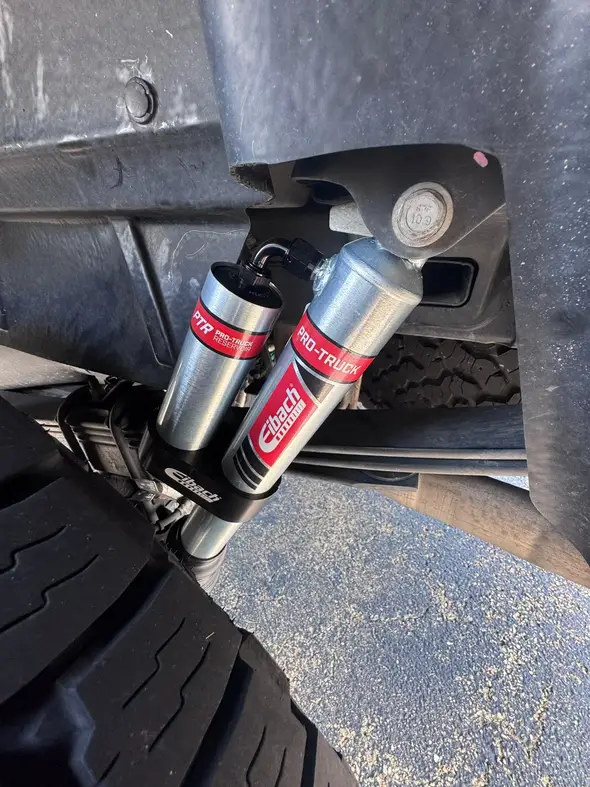 Eibach rear reservoir shock photographed inside the F-150 wheel well