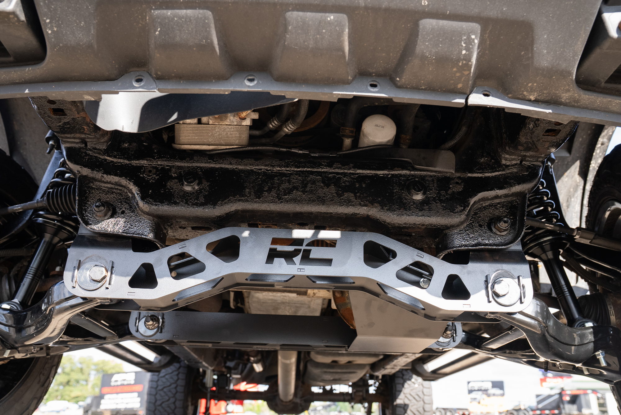 Centered underside view of the Rough Country front suspension crossmember on this F-150