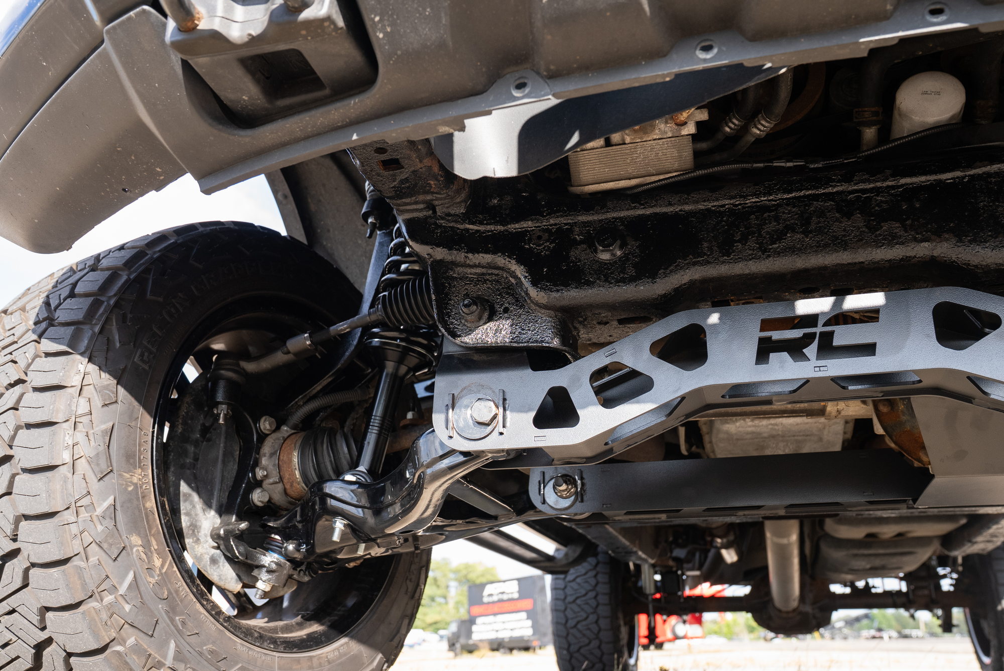 Angled underside view of the installed Rough Country suspension crossmember and front hardware