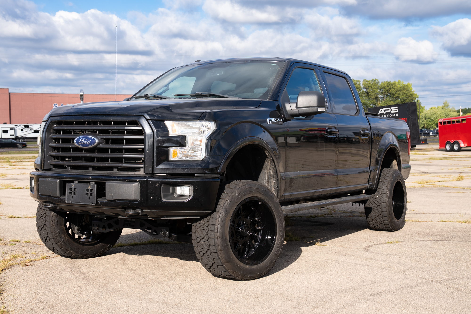 Black Ford F-150 outside the APG Customs shop after its suspension work