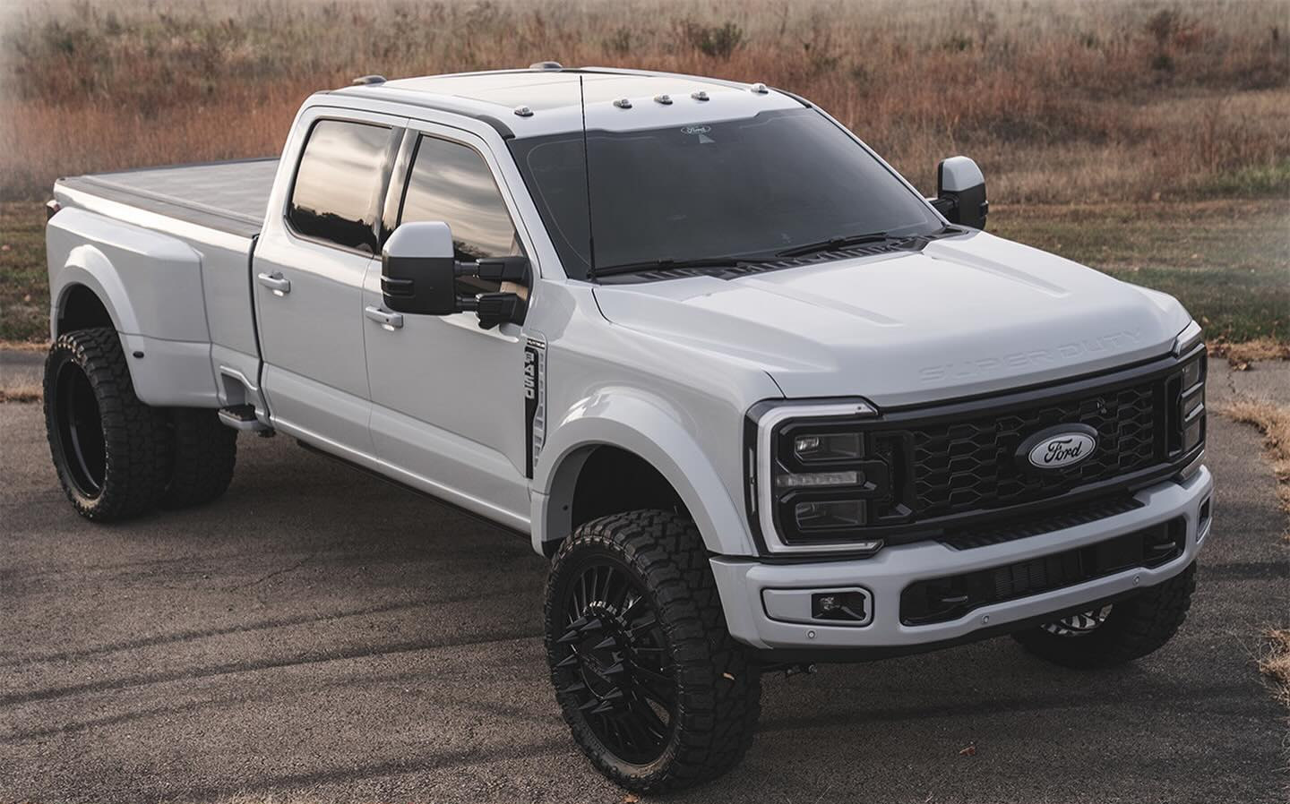 White 2026 Ford F-450 Platinum Plus with full paint match and 26-inch JTX wheels by APG Customs
