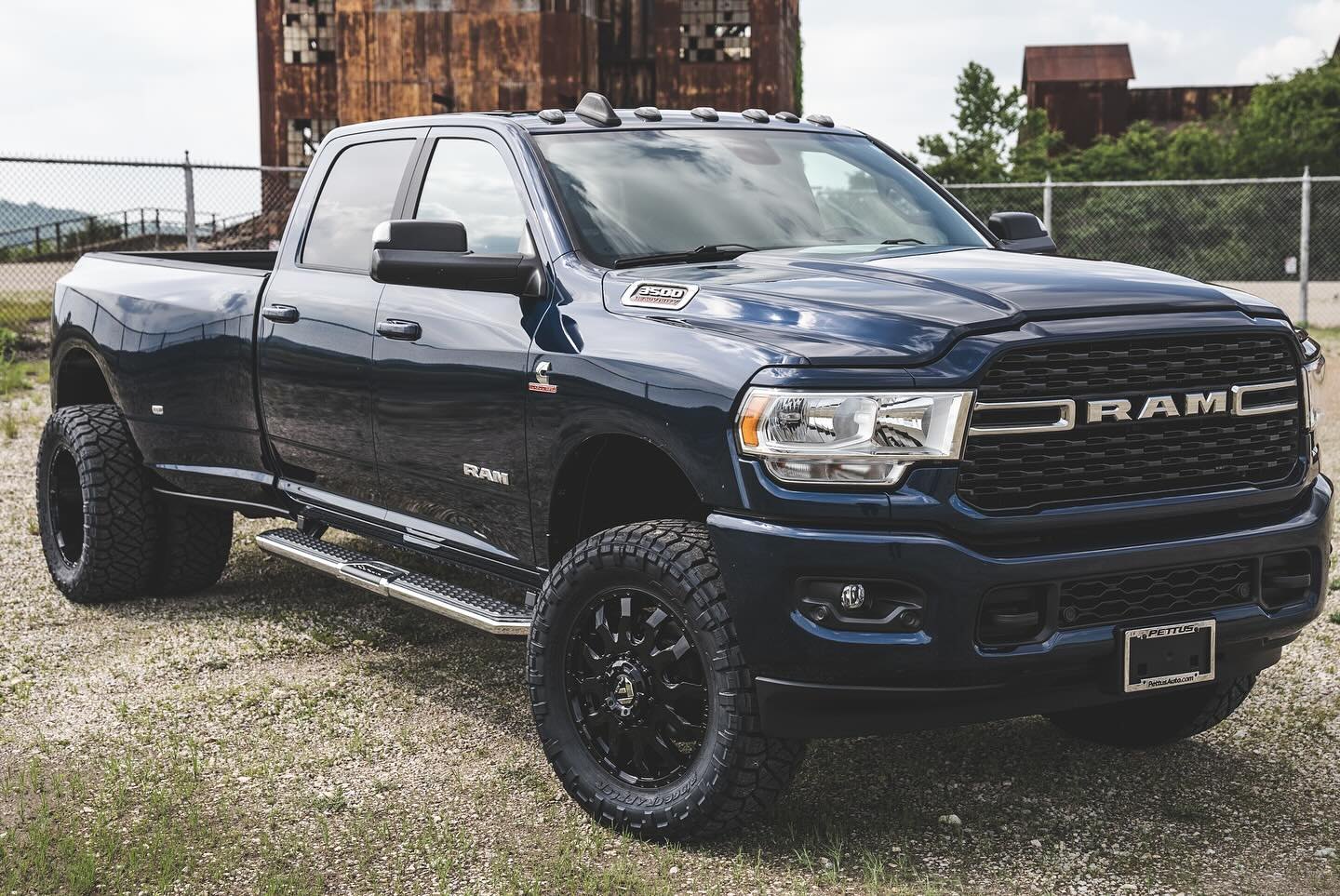 Dark blue 2022 Ram 3500 Big Horn with black Fuel Blitz wheels and Nitto Ridge Grappler tires