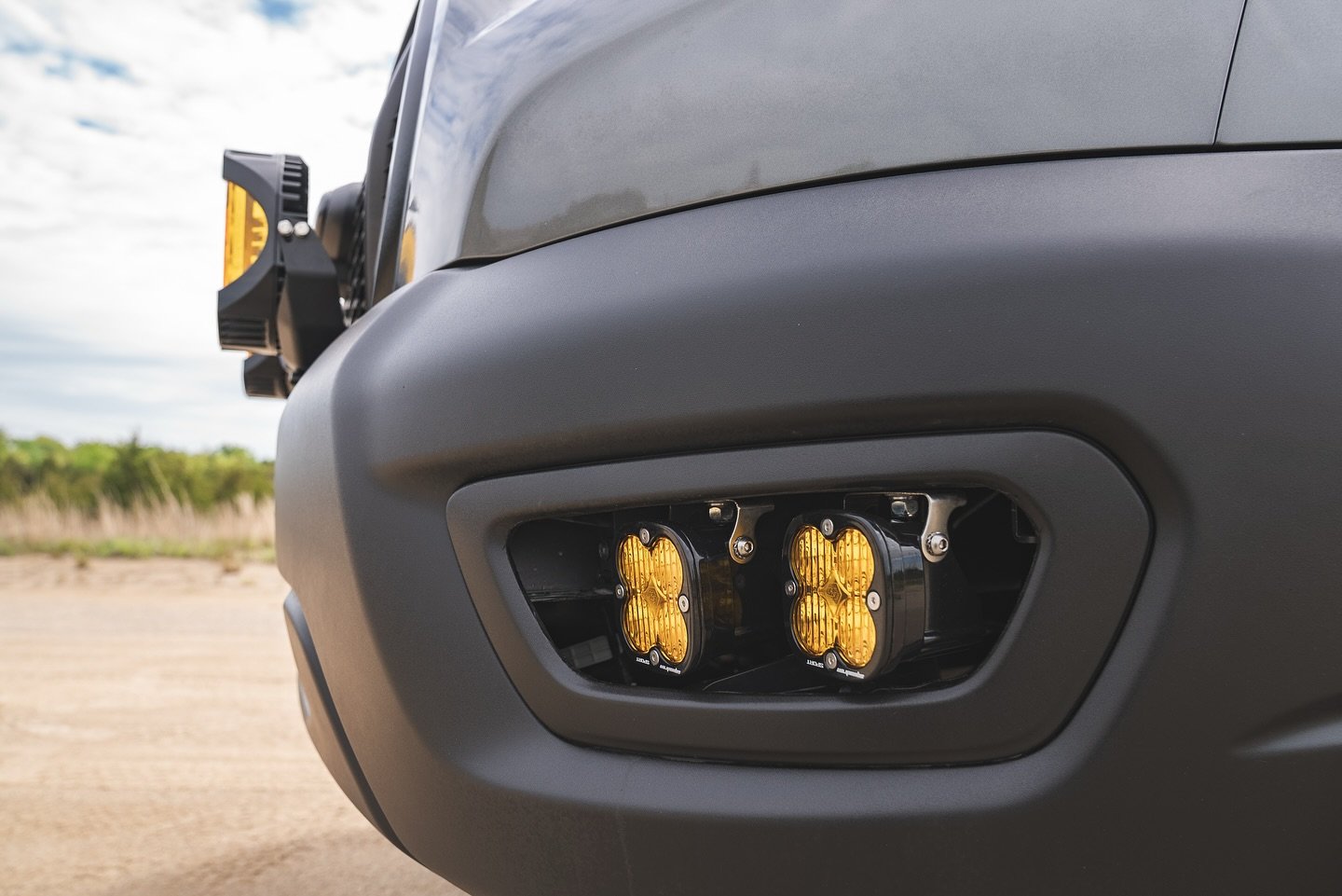 Amber Baja Designs fog-light pods fitted into the Transit front bumper