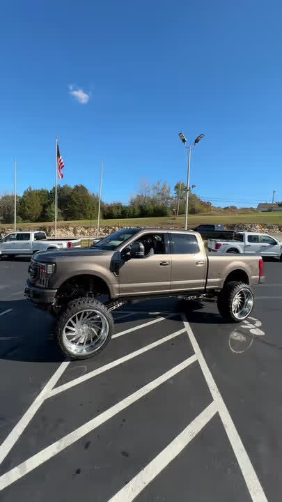 Lifted Ford F-250 Limited on oversized polished wheels
